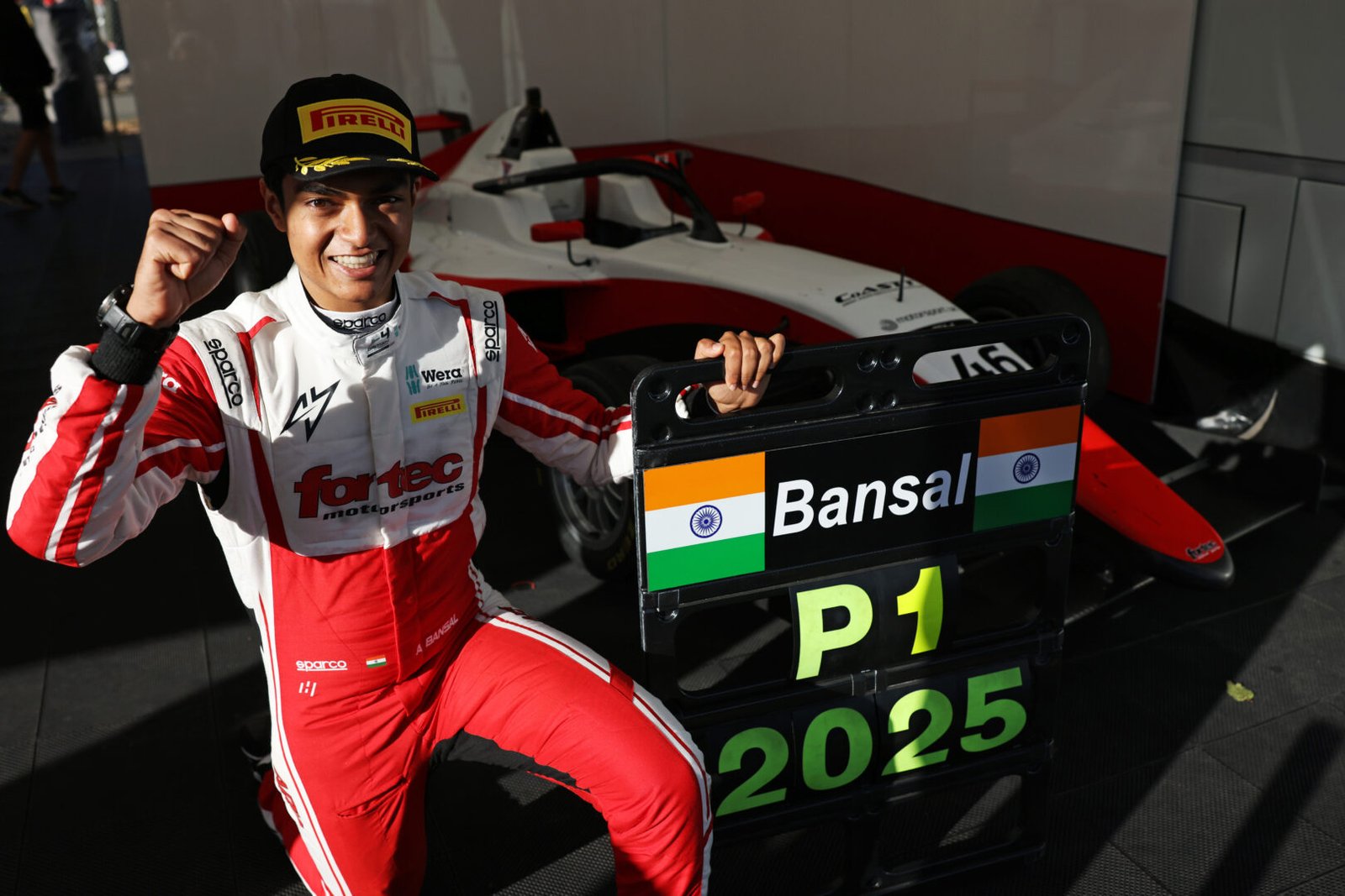 Ary Bansal posing with P1 board after his win.