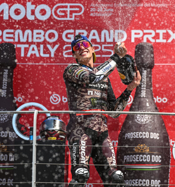 Marc Marquez celebrates on the podium after winning the MotoGP Grand Prix of Mugello